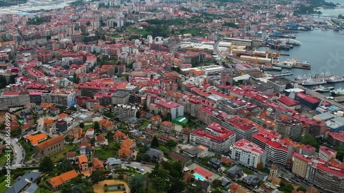 Aerial panorama view around the downtown in the harbor city Vigo in Spain on a cloudy summer afternoon.