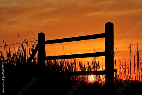 Sunset clouds fence silhouette farm 