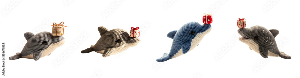 Obraz premium Four crocheted dolphins with presents on noses isolate handmade toy plush
