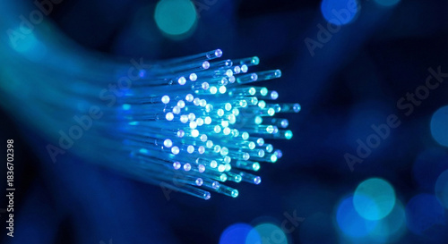 Фотография Blue Glowing Optical Fiber Cables Technology Background