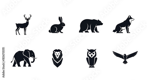 Silhouettes of Wild Animals Featuring Deer, Bear, Wolf, Elephant, Lion, Owl, Rabbit, and Eagle in Minimalist Graphic Style on White Background