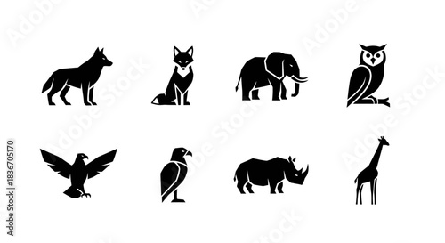 Dynamic collection of diverse wild animal vector silhouettes, featuring majestic predators and iconic herbivores, presented in a clean, minimalist graphic style for versatile use