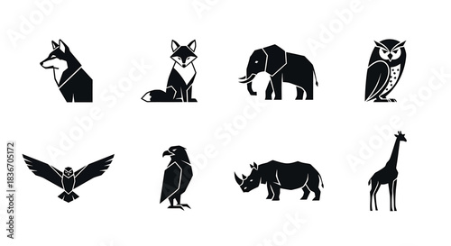 Silhouetted Wild Animals Icon Set featuring Dog, Fox, Elephant, Owl, Eagle, Hawk, Rhino, and Giraffe in Minimalist Vector Style for Graphic Design