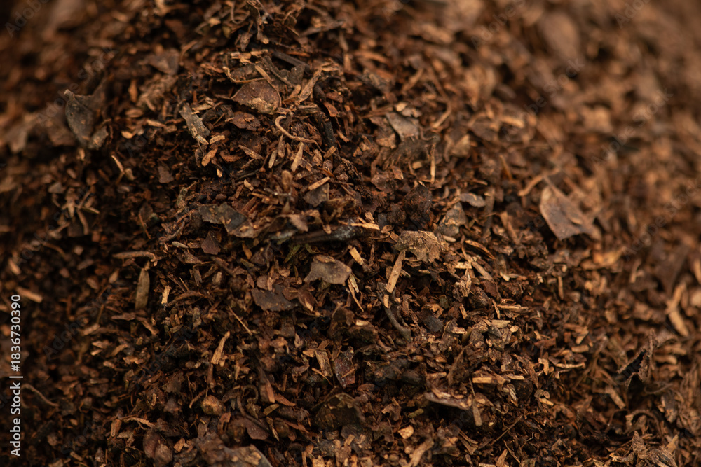 Fototapeta premium Soil mixed with compost and dry leaves background.