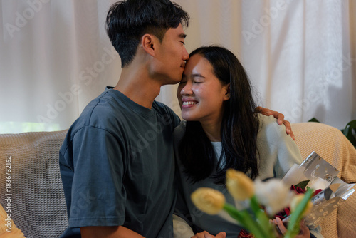 Tableau sur toile Young couple happy in love, man woman home, romantic valentine day celebration,