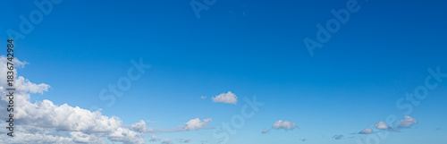 Deep Blue Sky with White Clouds, background.