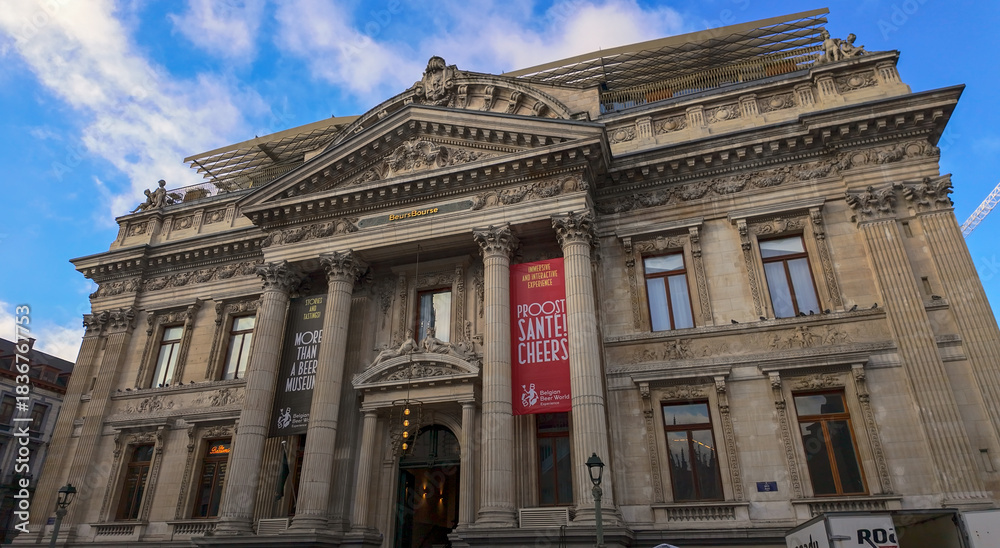 Naklejka premium BRUSSELS, BELGIUM - NOVEMBER 26, 2025 - Brussels Bourse, a neoclassical landmark, now home to an interactive Belgian Beer World museum
