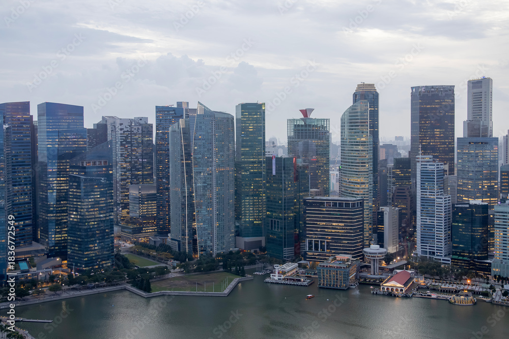 Fototapeta premium Aerial view of the famous Singapore skyline as seen on a cloudy day