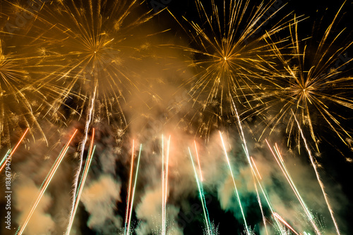 The blurred background of fireworks (light trails) is beautiful at night, seen in the New Year holidays, Christmas events, for tourists to take pictures during public travel.
