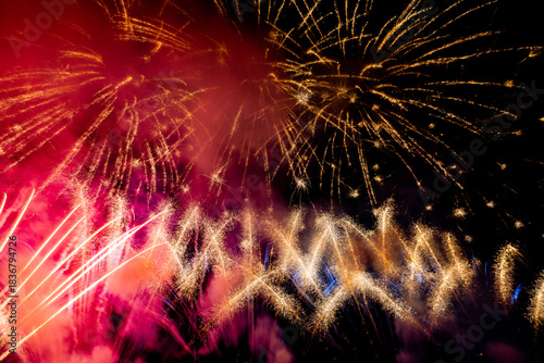 The blurred background of fireworks (light trails) is beautiful at night, seen in the New Year holidays, Christmas events, for tourists to take pictures during public travel.