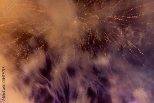 The blurred background of fireworks (light trails) is beautiful at night, seen in the New Year holidays, Christmas events, for tourists to take pictures during public travel.