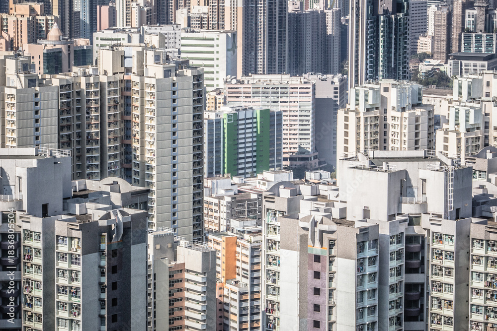 Fototapeta premium A dense urban landscape with high-rise residential buildings of varied styles and heights, showing modern city development.