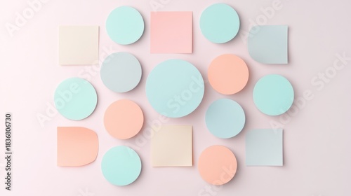 Colorful sticky notes and paper shapes arranged creatively on a pastel background for office organization and planning