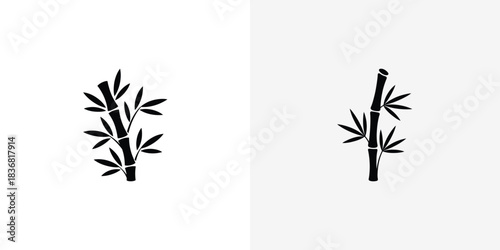 Simple black bamboo stalks with delicate leaves in a serene natural style