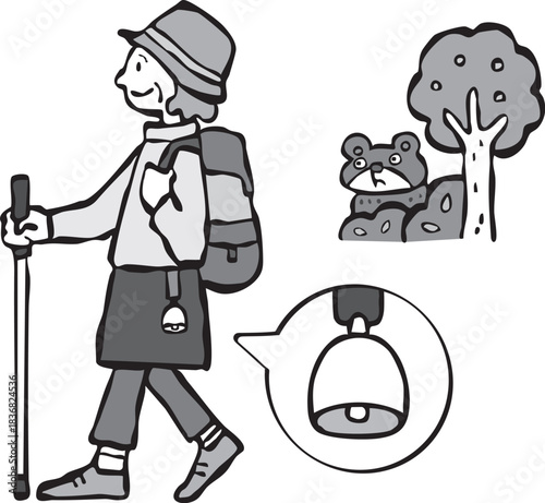 熊よけの鈴をつけて山登りをする女性（シニア）