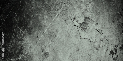 A wide panoramic background image featuring a dark and dramatic grunge concrete wall texture.