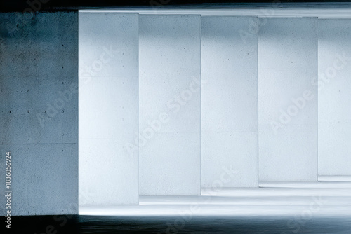 Modern architectural space featuring clean lines and illuminated concrete walls in a minimalistic design environment