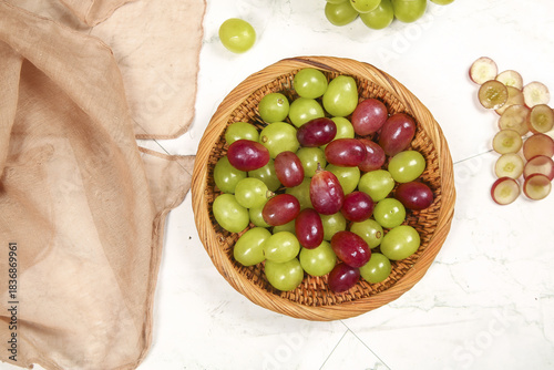 Fresh Red and Green Grapes in Woven Basket