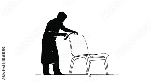 Silhouette of a person meticulously cleaning a chair with a cloth, highlighting care and tidiness.