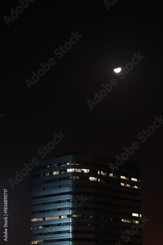 night view of the city and building with moon