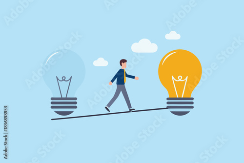 Businessman walks on a tightrope between two large light bulbs representing ideas and innovation