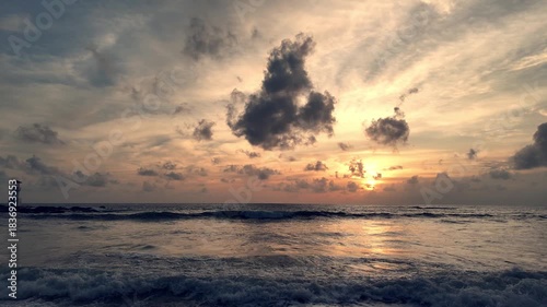 Aerial view of tranquil seaside lighthouse at sunset shoreline 