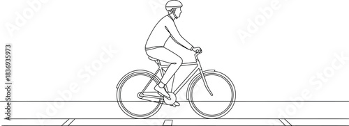 Cyclist Riding Bike on Road Lane