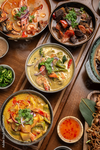 mix of traditional thai curries on restaurant table in phuket thailand