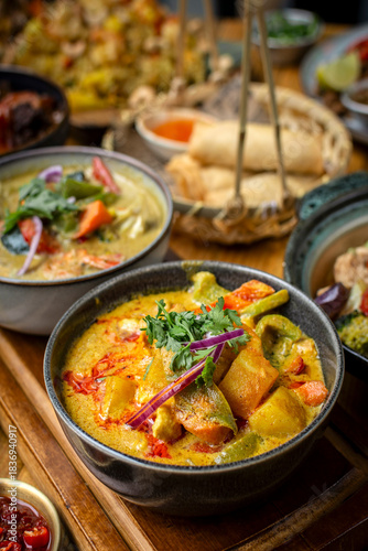 mix of traditional thai curries on restaurant table in phuket thailand