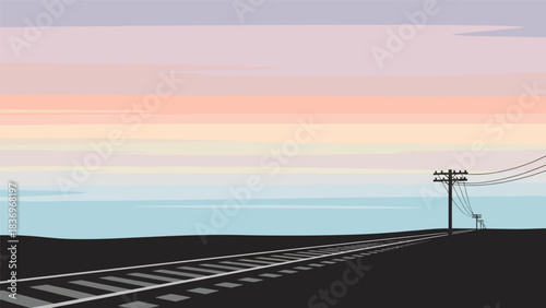Railway tracks stretching towards the horizon with a utility pole.