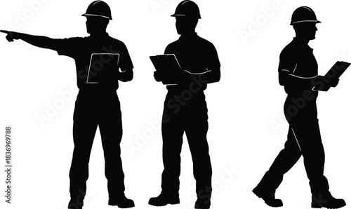 Silhouettes of male construction workers, engineers, or architects in safety hard hats, standing and walking while holding clipboards, giving direction and inspecting the site plan.