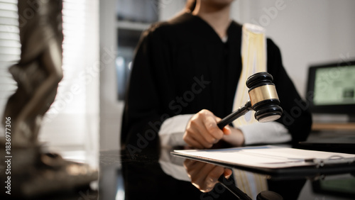 Canvastavla A judge raises gavel in courtroom, poised to deliver formal ruling, global justice, international law, digital regulation, modern legal authority across criminal, trade, cyber, humanitarian fields