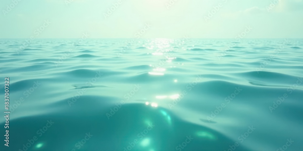 Obraz premium Serene Aqua Marine Gentle Waves Reflecting Sunlight on a Calm Ocean Surface