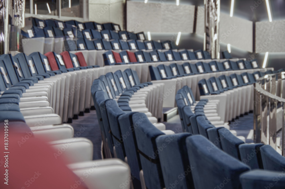 Naklejka premium Ultra modern futuristic show lounge theatre with seat rows onboard luxury mega cruiseship cruise ship liner