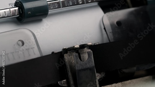 The end sign on old vintage typewriter. Retro footage in office. End of story.