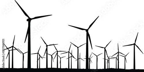 Silhouette of a large wind farm with many turbines against a bright sky