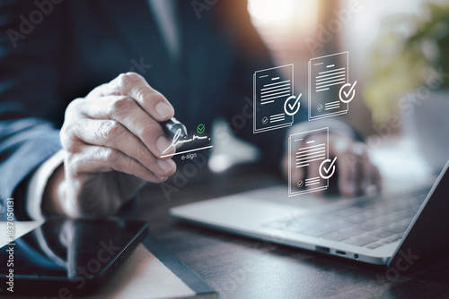 Photos Businessman hand signing electronic signature on virtual document
