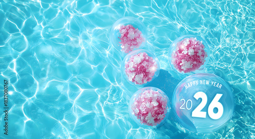Happy New Year 2026 written on a transparent  balloon with others balloons decorated with pretty floral patterns on a blue swimming pool water. Copy text.