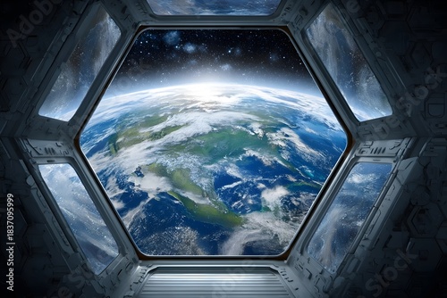 The Earth appears through a hexagonal spaceship window, partially covered by clouds and illuminated by sunlight.