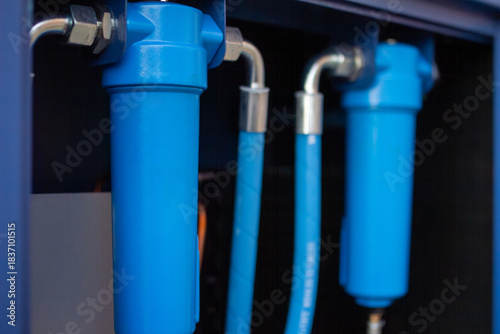 Fotografija Industrial compressed air dryer cabinet, highlighting two bright blue filtration