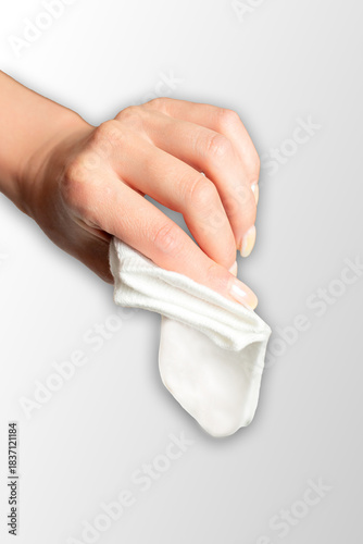 Legs and feet in comfortable white and grey ankle socks on a plain background isolated
