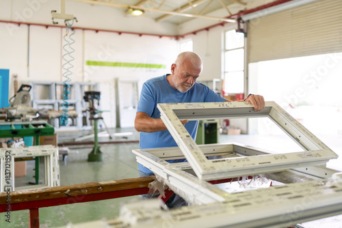 Control of materials for the production of PVC and aluminum profiles. A senior craftsman selects the material for the production of windows and doors.
