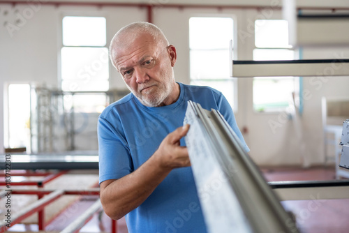 Control of materials for the production of PVC and aluminum profiles. A senior craftsman selects the material for the production of windows and doors.