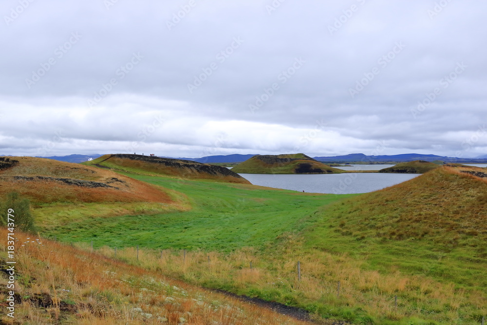 Fototapeta premium Pseudo craters, volcanoes and geothermal areas near Skutustadir at lake Myvatn in Iceland