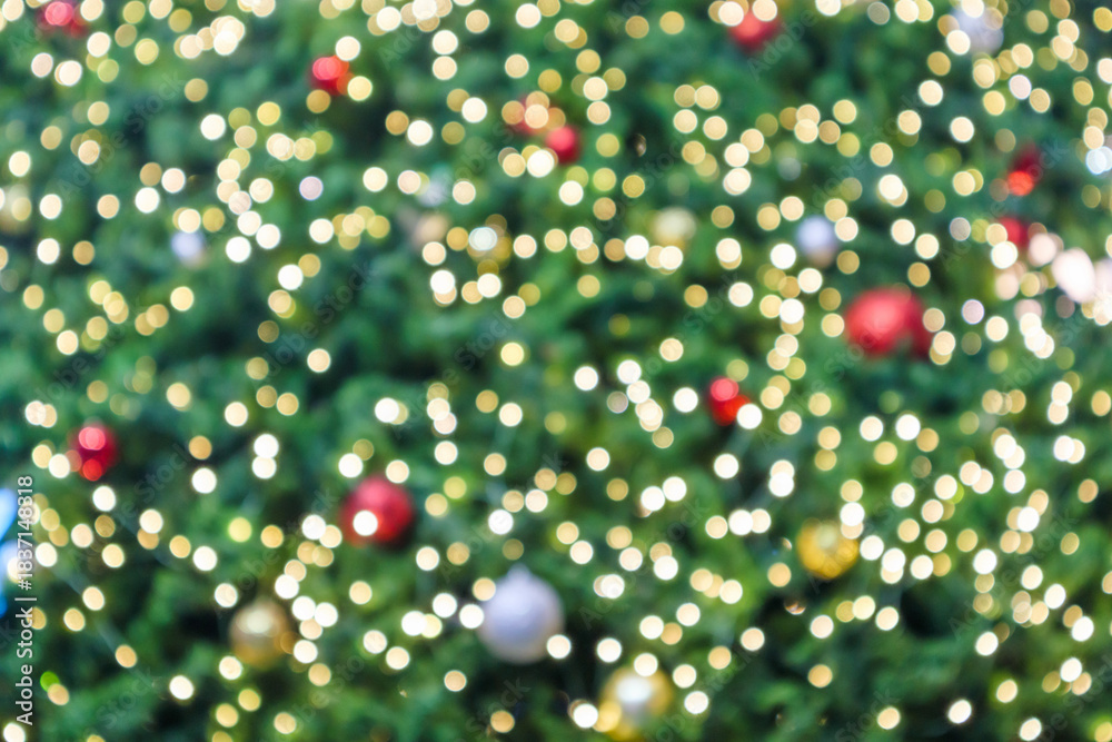 Fototapeta premium Abstract Christmas holiday with festive gold bokeh light on Christmas tree blurred background