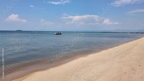 Mangochi Malawi Africa. 01.12.2025. Video. Fishermen rowing a boat on Lake Malawi iat Mangochi n southern Malawi Africa