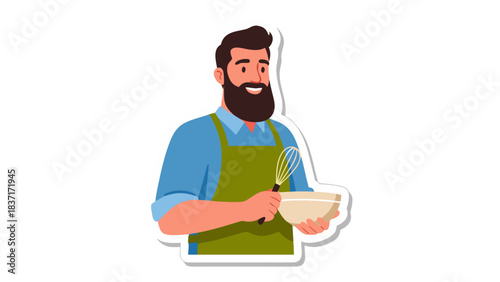 Smiling Bearded Man In Blue Shirt And Green Apron Holding Bowl And Whisk Preparing Food In Kitchen Studio Lighting Isolated On Black Background