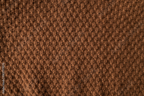 Wallpaper Mural Texture of knitted brown wool-cotton sweater. Soft, cozy, warm, winter or fall garment features a large interwoven pattern, ornament. Close-up of the garment. Trendy Color of the Year 2025 Torontodigital.ca