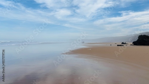 beach in the morning with beautiful clouds in the sky