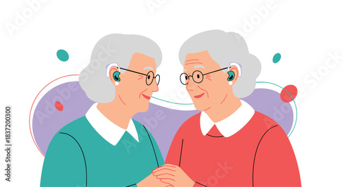 Two smiling senior women friends wearing hearing aids and holding hands against an abstract background.